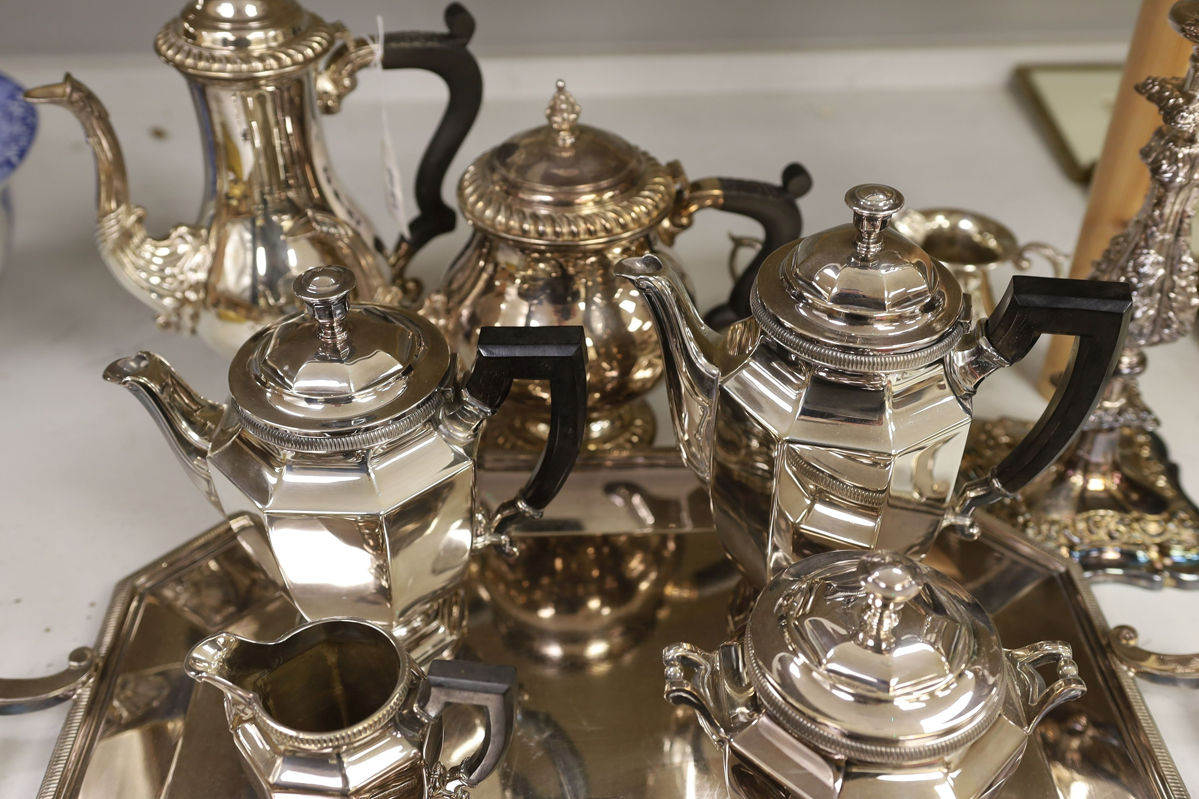 A French plated Cristofle tea set, together with other plated tea wares and a candelabrum